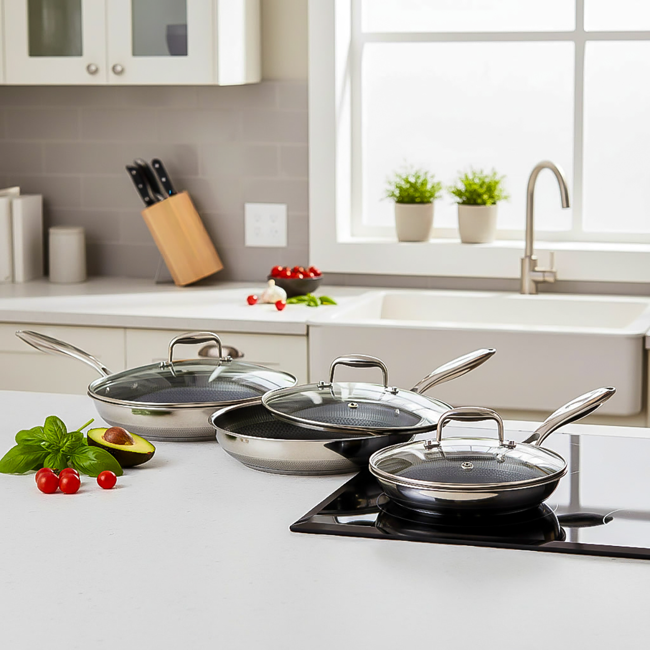 Three-piece VERTEX premium stainless-steel cookware set featuring 20 cm (8"), 26 cm (10"), and 30 cm (12") frying pans, each with a matching safety glass lid. Precision laser-etched hybrid cooking surface delivers even heat distribution and easy quick-release cooking for searing, sautéing, and frying. Durable, PFOA-free construction compatible with all cooktops including induction and oven safe to 260 °C, combining professional performance with sleek modern design.